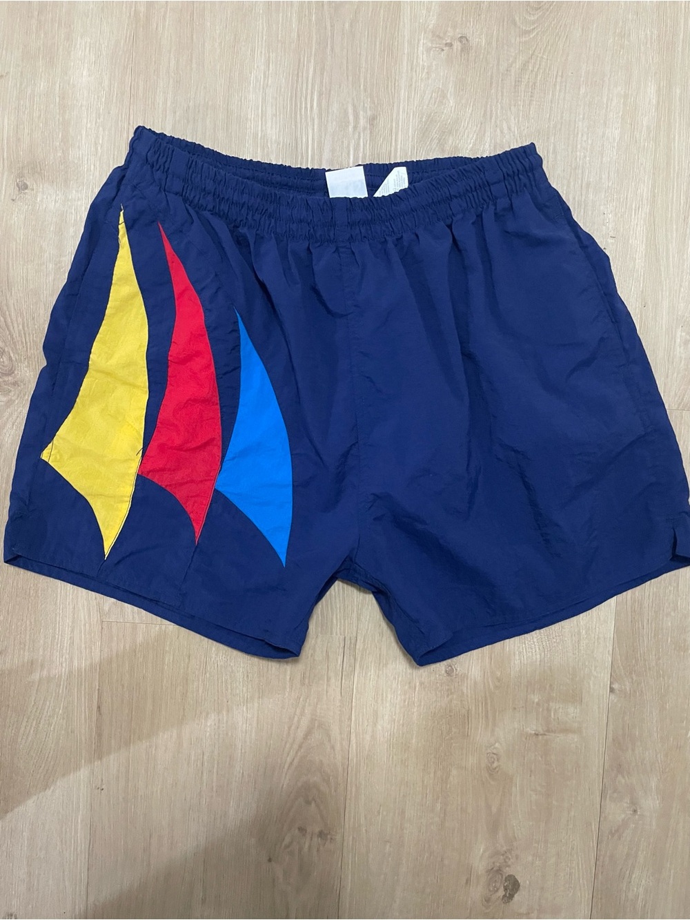 * VINTAGE 1990’s Athletic Works Navy Swim Trunks with Yellow, Red & Blue Panels